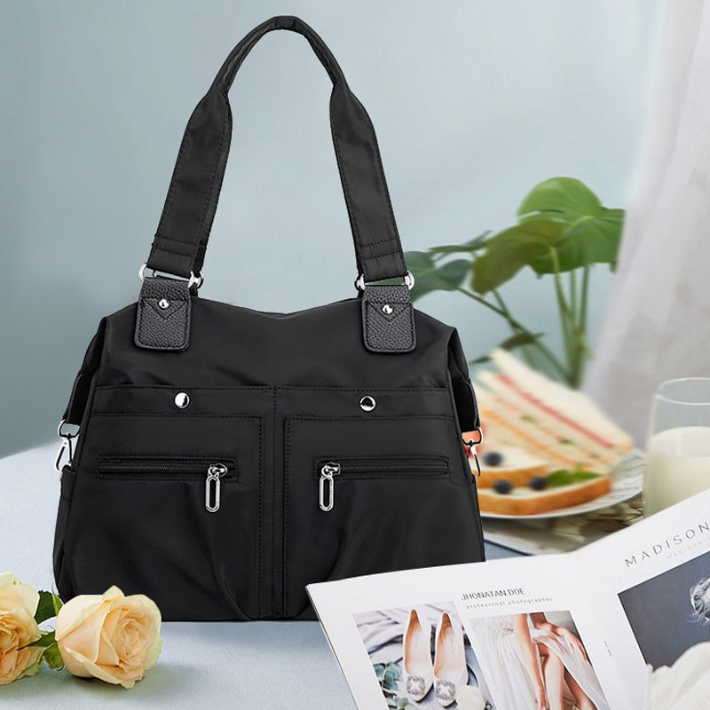 Vízálló nagy kapacitású nylon válltáska több zsebbel